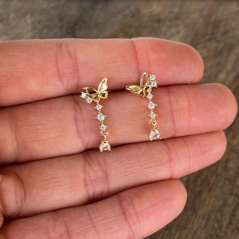 BRINCO BORBOLETA C/ PEDRAS CRISTAL