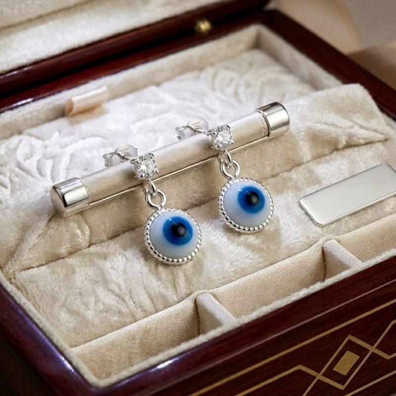 BRINCO OLHO GREGO BRANCO