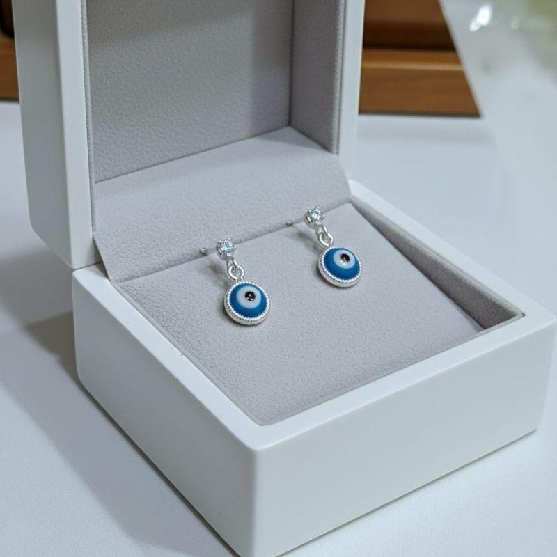 BRINCO OLHO GREGO AZUL CLARO