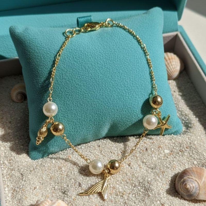 PULSEIRA BOLA PEROLA CONCHA ESTRELA RABO SERIA