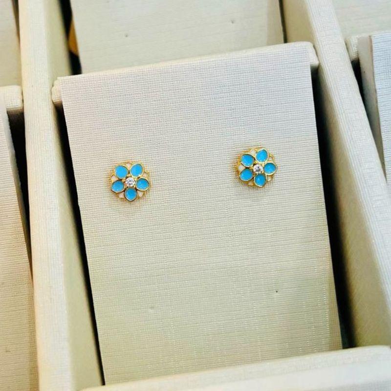 BRINCO FLOR AZUL C/ ZIRCONIA NO CENTRO INFANTIL