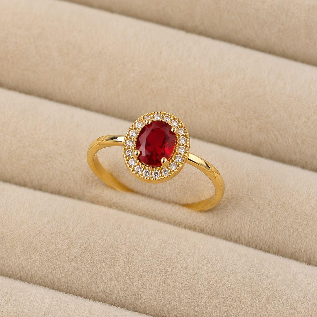 ANEL OVAL CRAVEJADO PEDRA VERMELHO